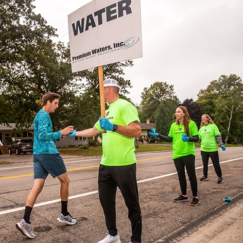volunteers-giving-water volunteers handing out water